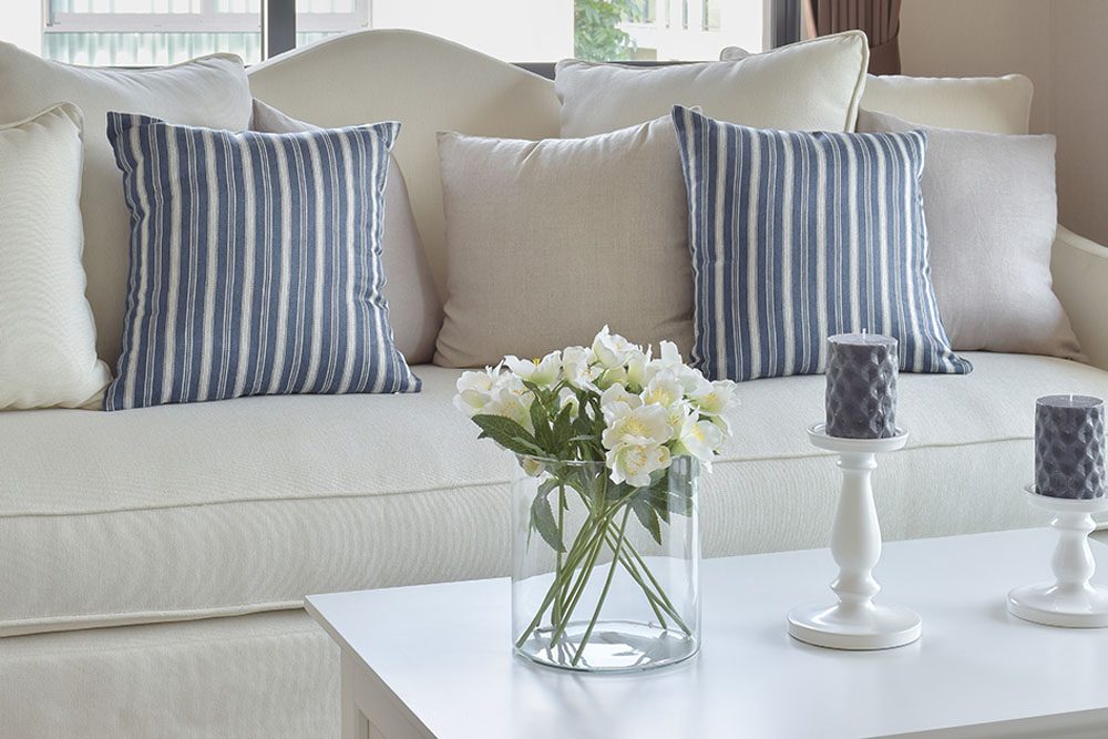 Bright living room with a freshly cleaned sofa and carpet